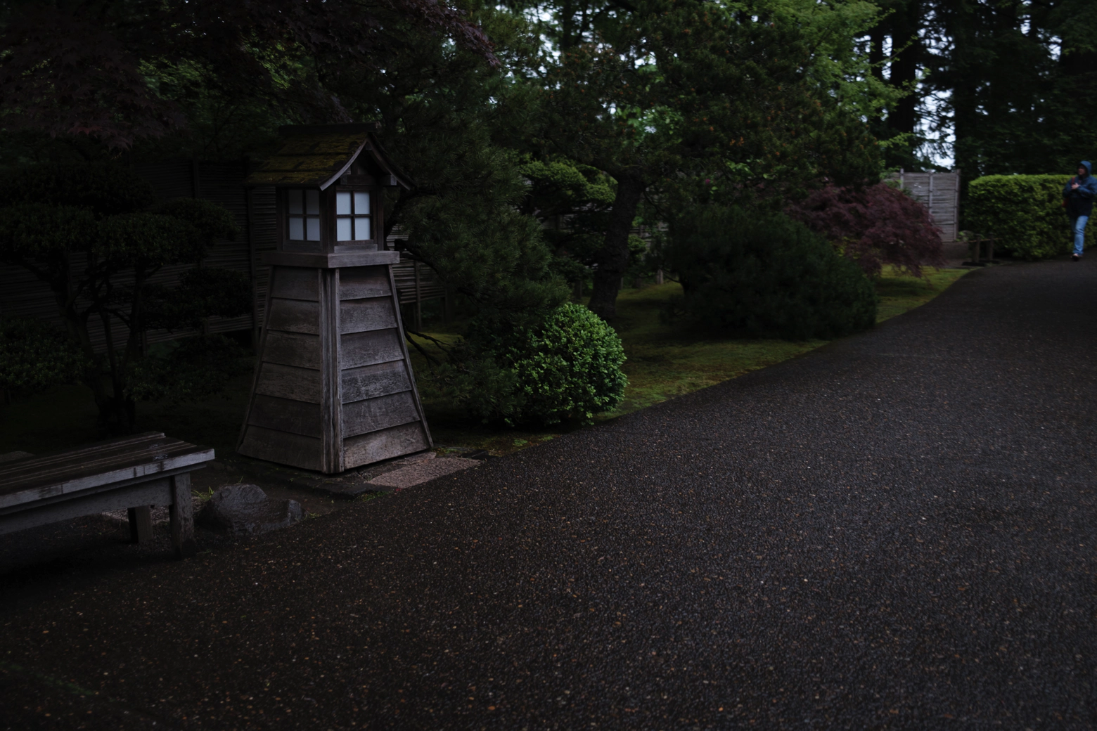 A Japanese lantern in the middle of the street.